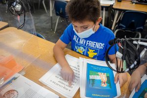 Andrew Hernandez, a Dunn Elementary School third-grade student, reads through his story “Animal helpers,” a story he created with Footsteps2Brilliance’s “Create-A-Book” feature.