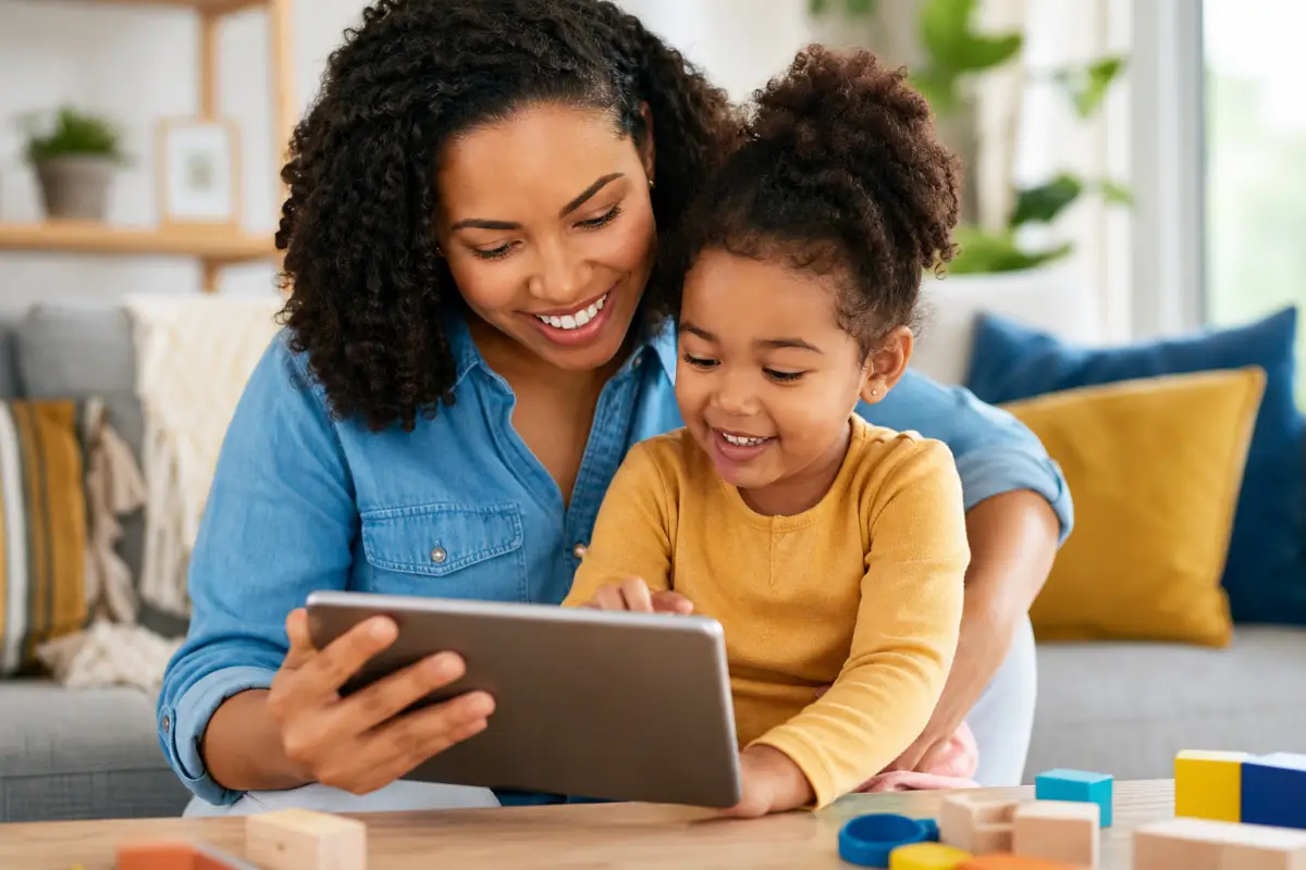 Mother and daughter using educational app on tablet